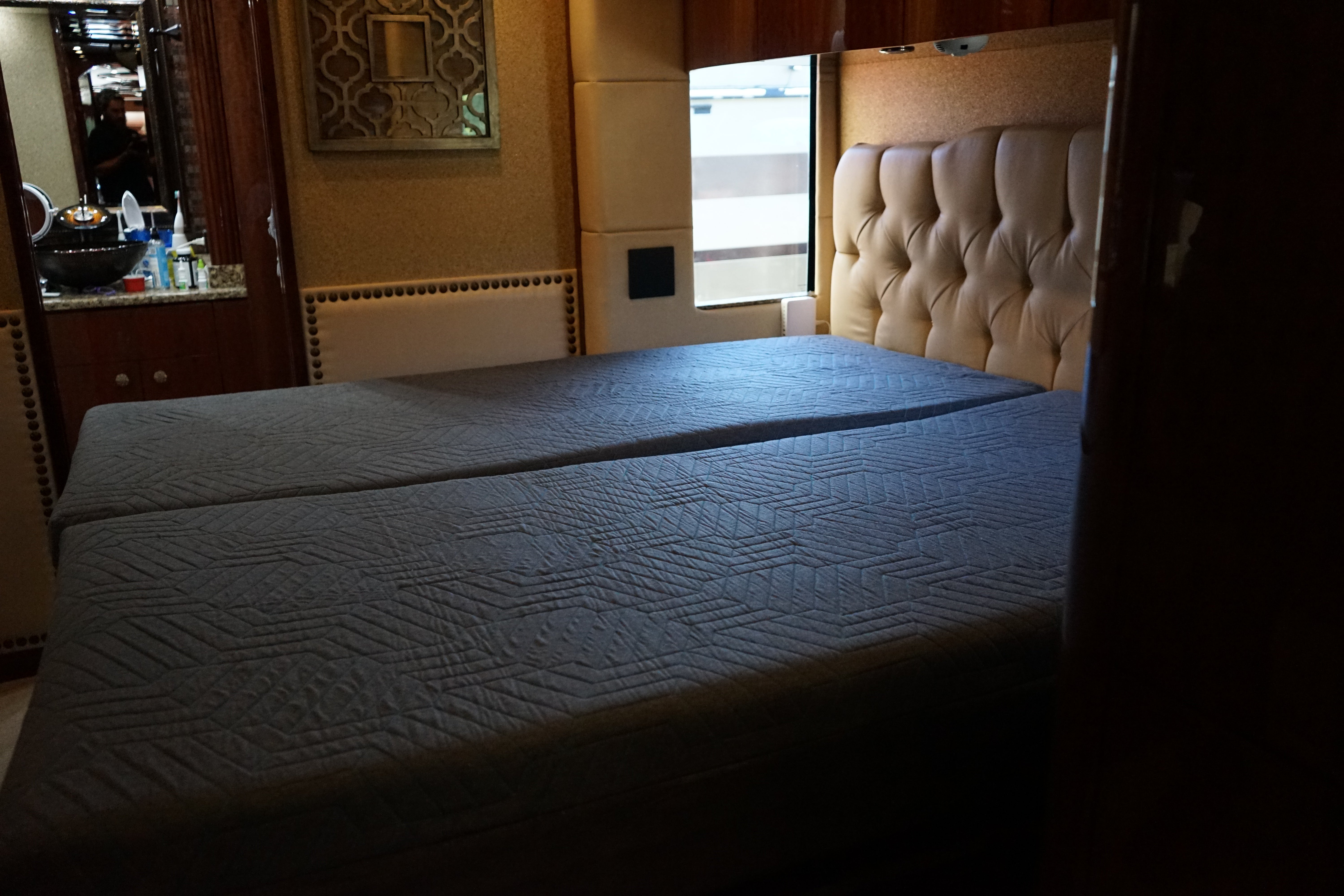 Deep Sleep Solutions split adjustable bed installed in a luxury Prevost motorcoach master suite