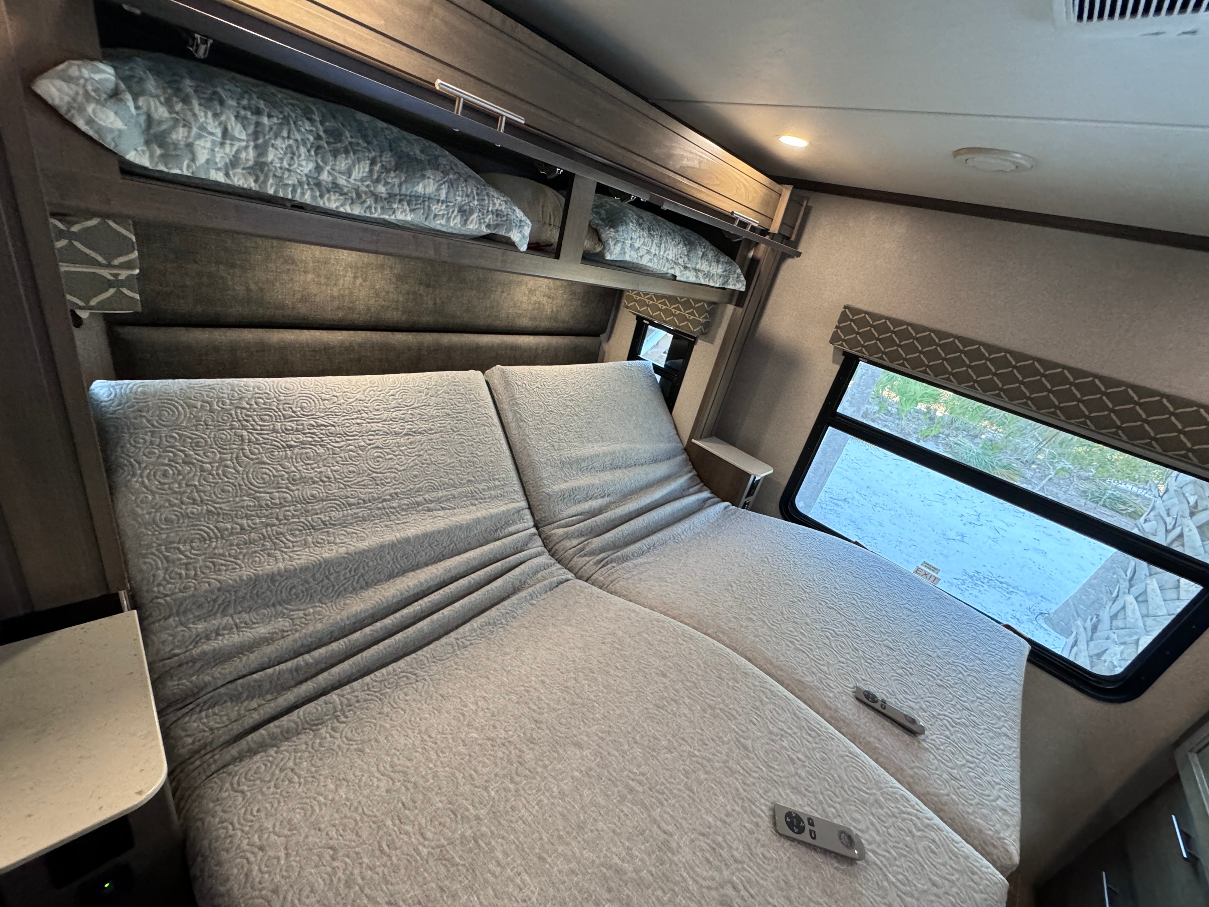 DSS adjustable bed with head and foot articulation raised, wireless remote visible