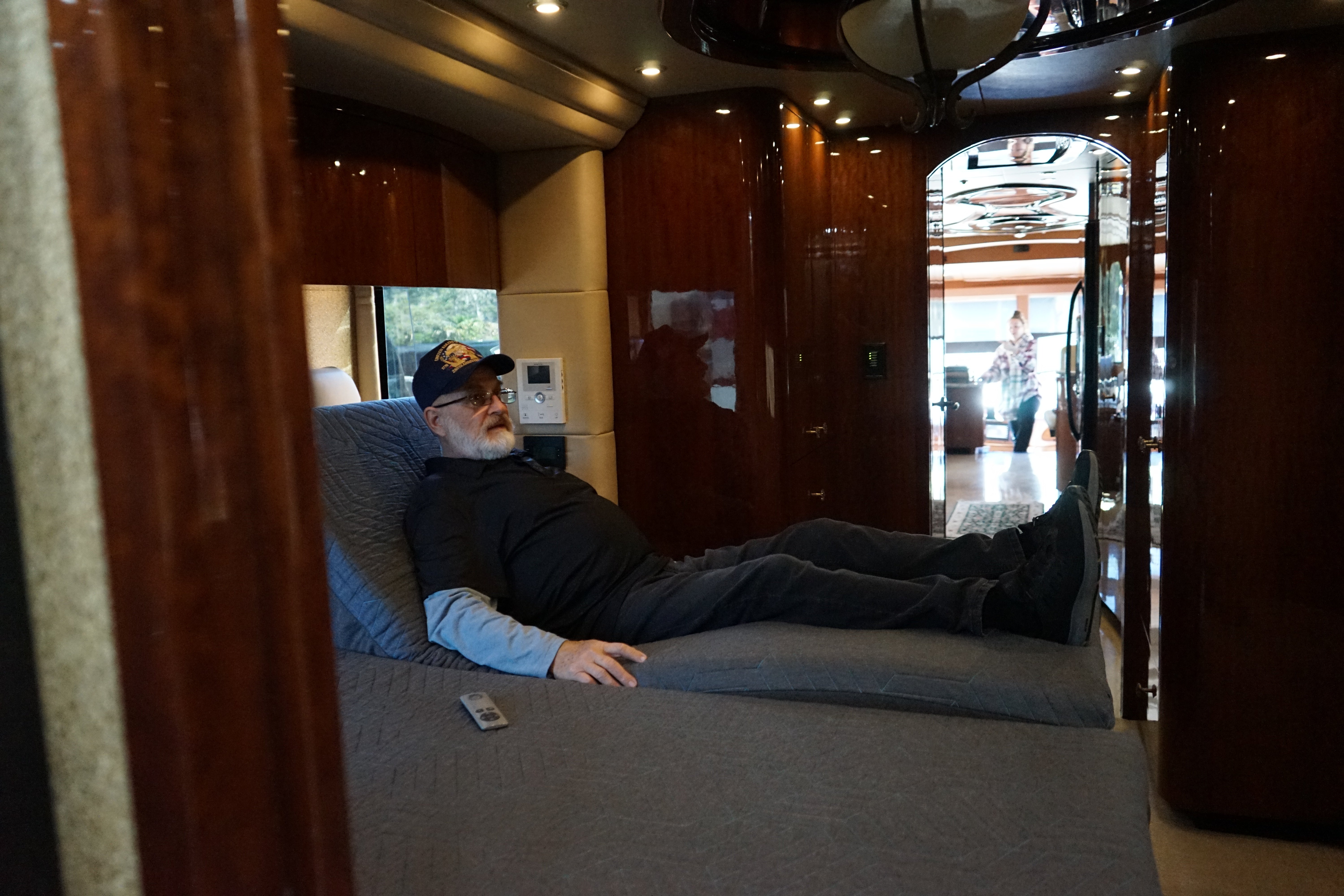 DSS Split King system installed in luxury Prevost with cherry wood interior